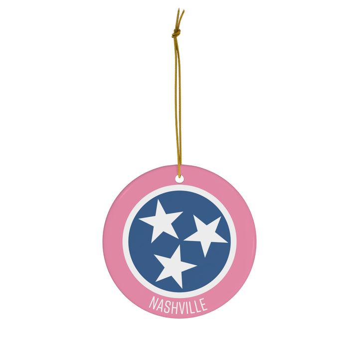 Southern-inspired pink, blue, and white tri-star ornament on a holiday tree, perfect for Nashville and Tennessee fans