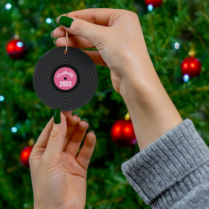 Nashville-inspired pink record ornament on a Christmas tree